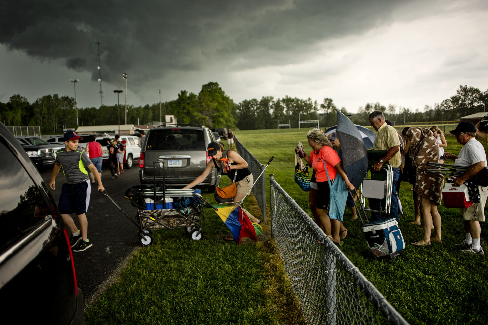 A storm approaches a softball field